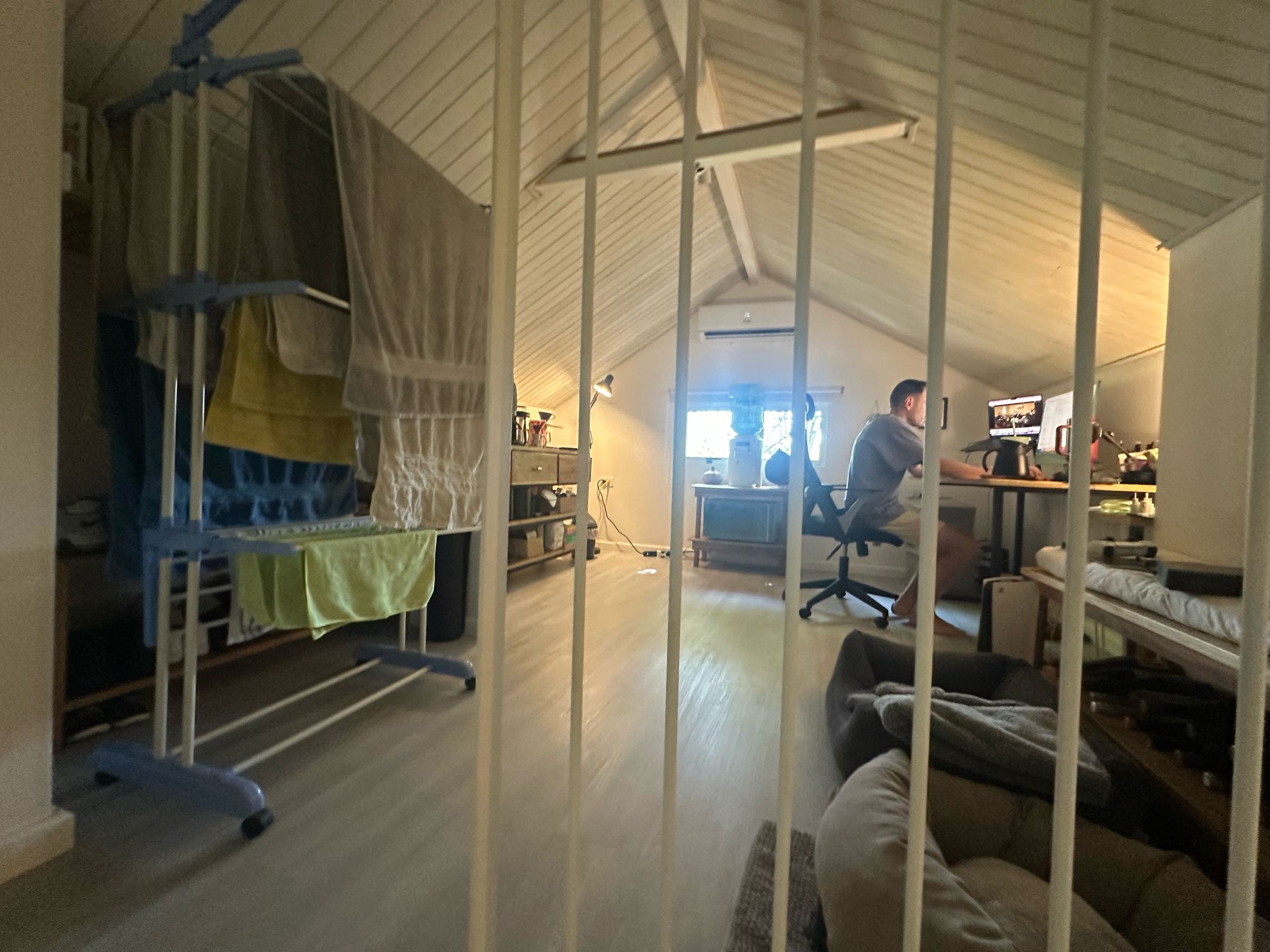 Loft-style second bedroom with office setup and balcony in Casa Mia Malpaís
